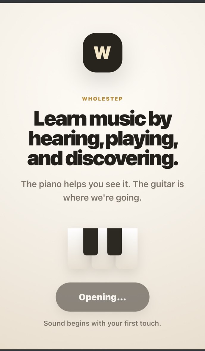 The Wholestep splash screen reading: learn music by hearing, playing and discovering. The piano helps you see it. The guitar is where we're going.